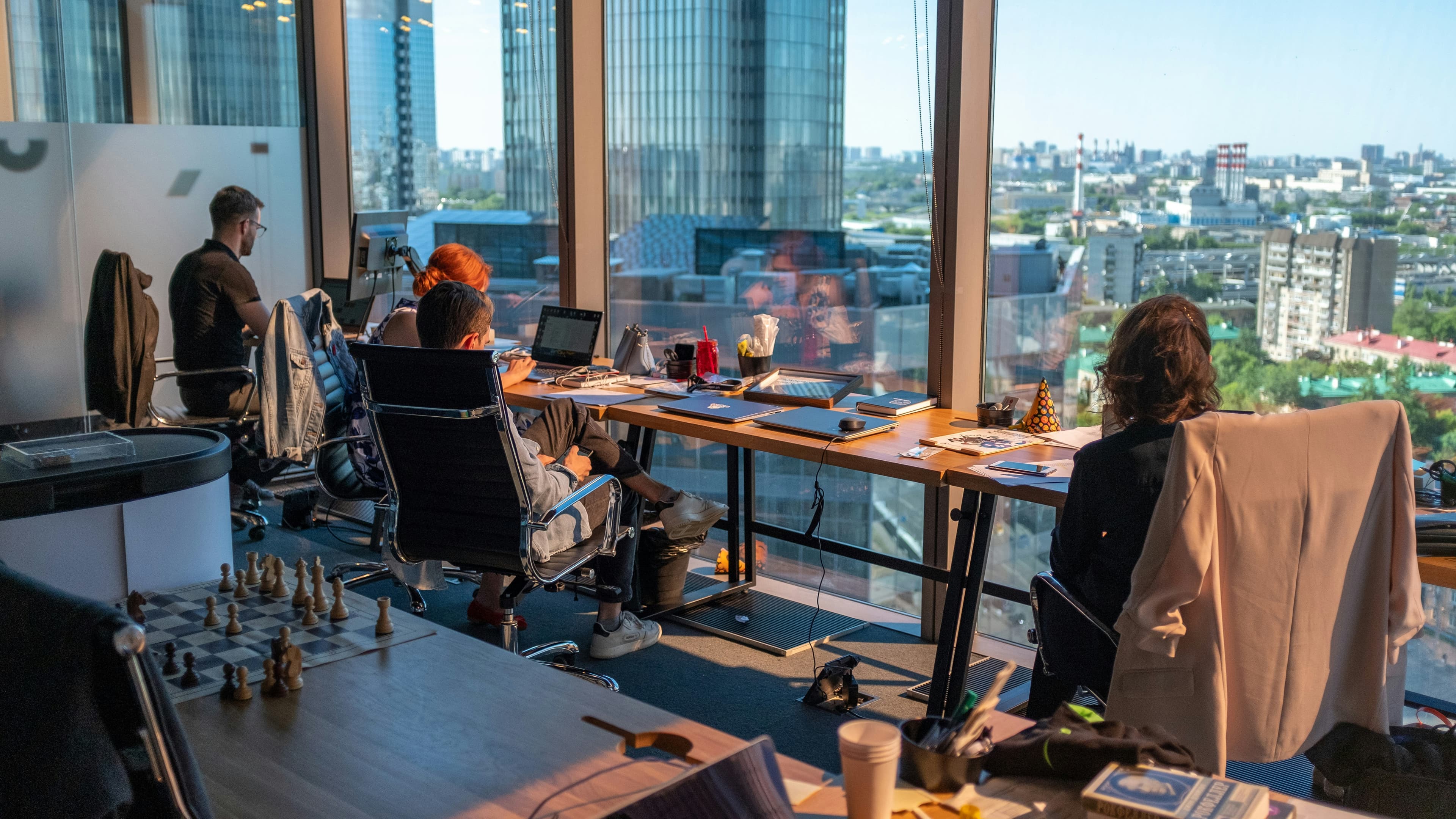 Bright collaborative workspace with desks and plants